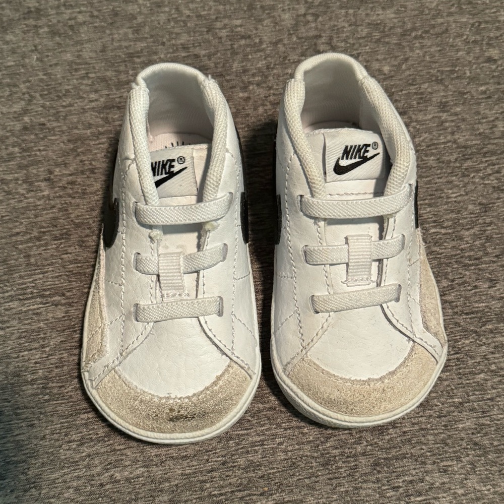 White Nike blazers.  Size 4